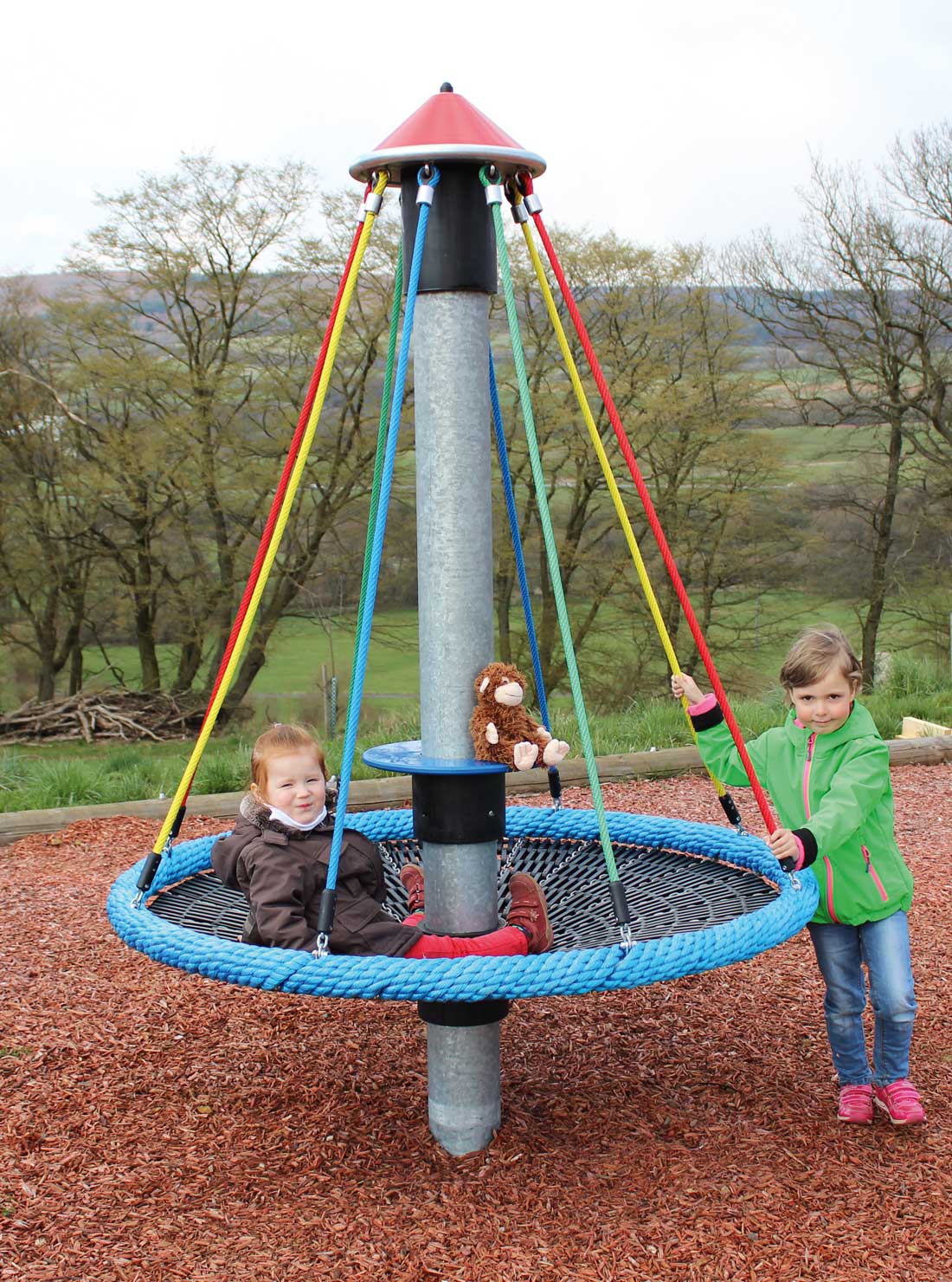 Children on Spinning Playground Equipment